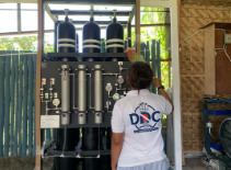 Diving center staff member beside the gas station